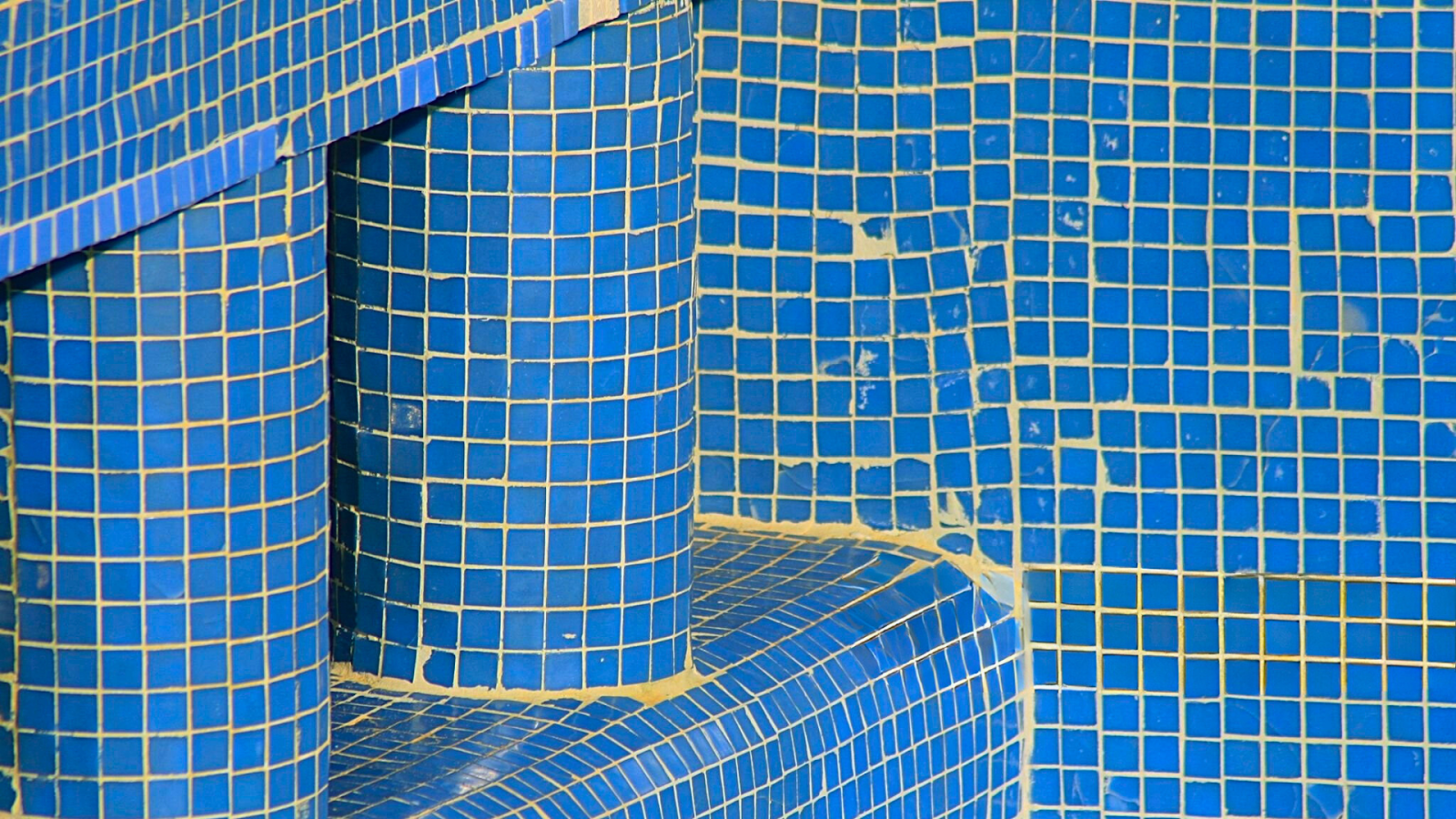 Pool interior flaws magnified through an acrylic window.