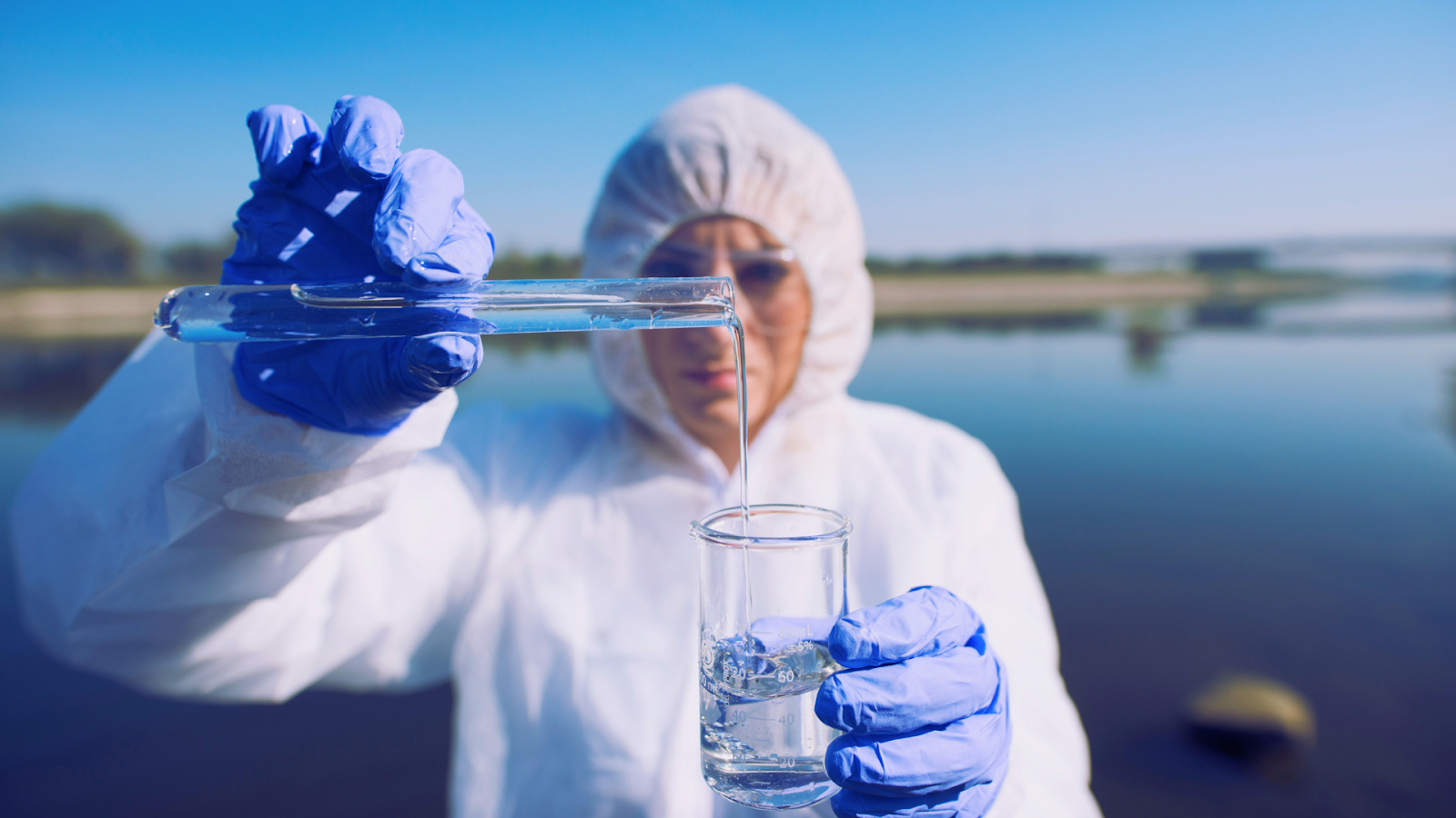 Pool technician analyzing water sample in a professional lab