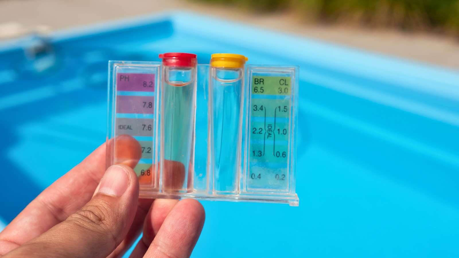 Using a liquid drop kit for accurate pool water testing.