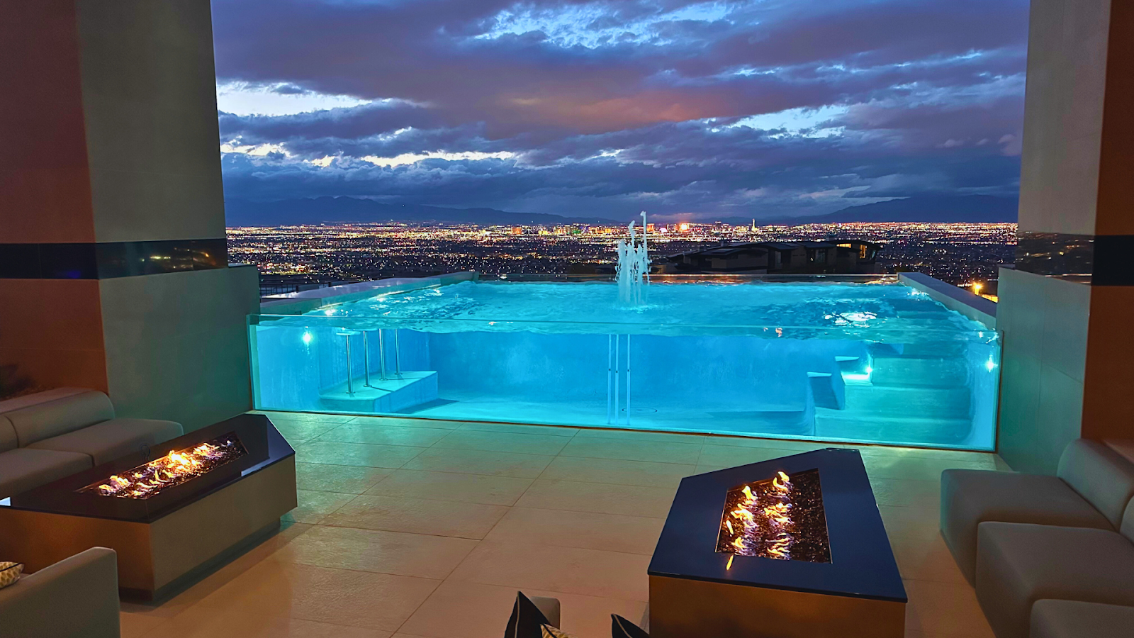 Example of a modern pool window integrated into a pool wall.