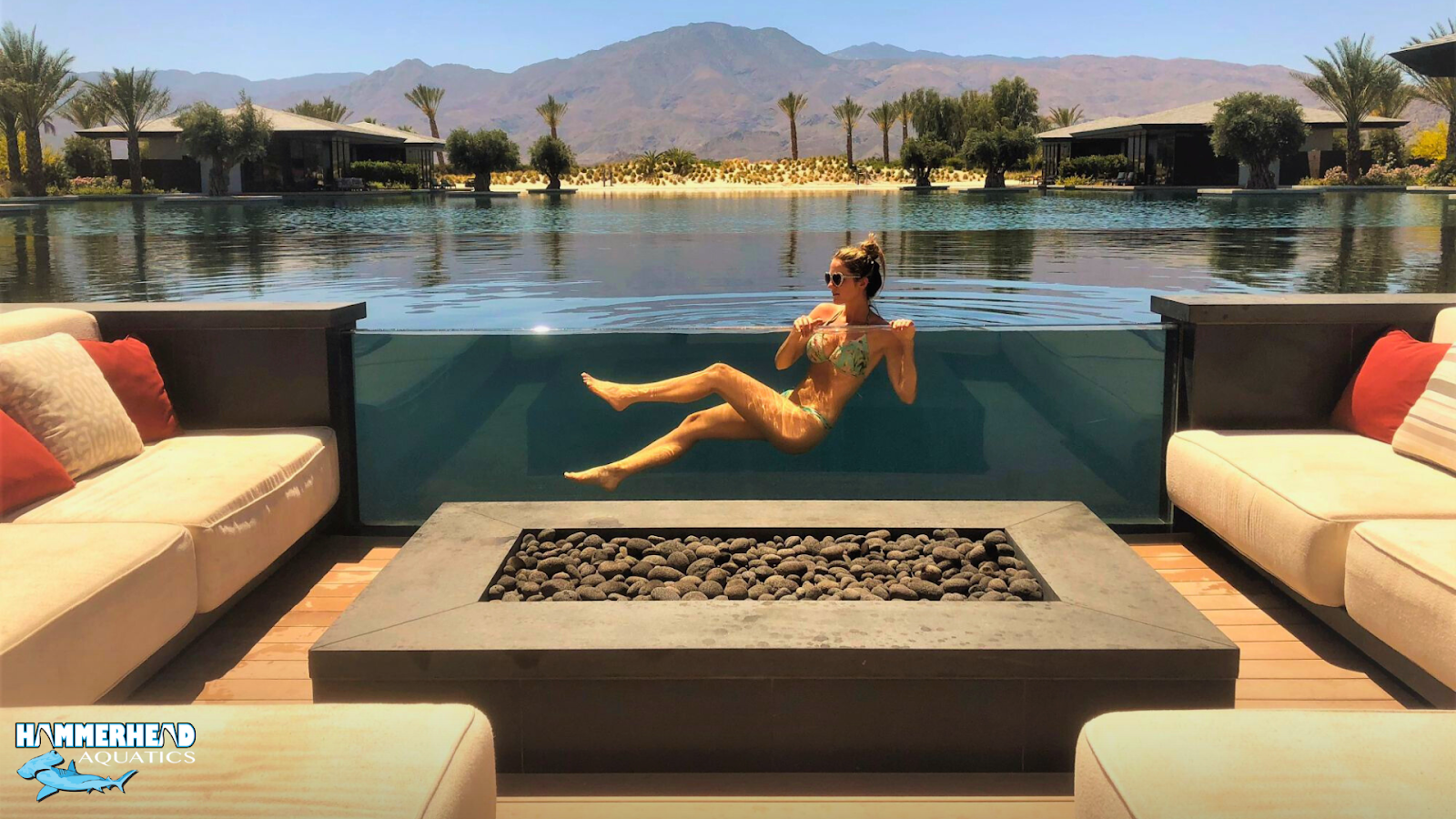 Modern pool window installed in a pool wall for underwater viewing.
