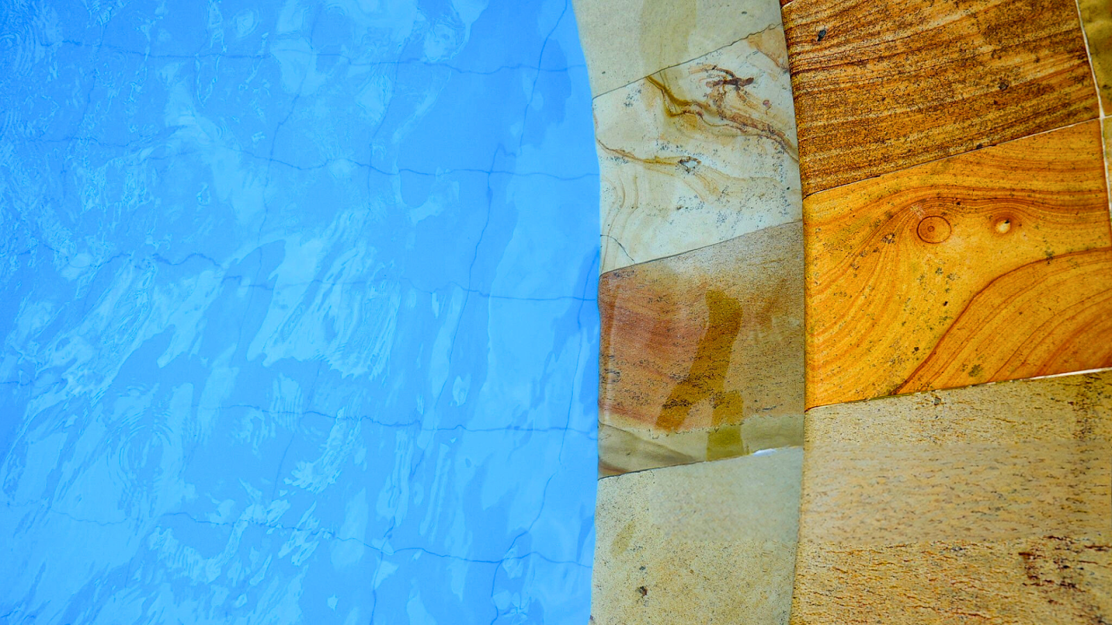 Rustic pool coping made with sandstone and limestone