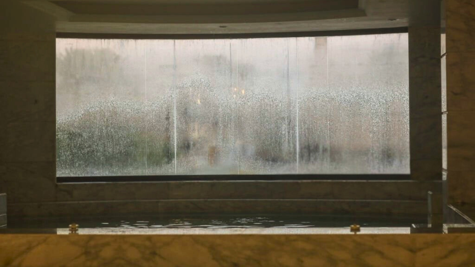 Condensation on indoor pool window caused by high humidity