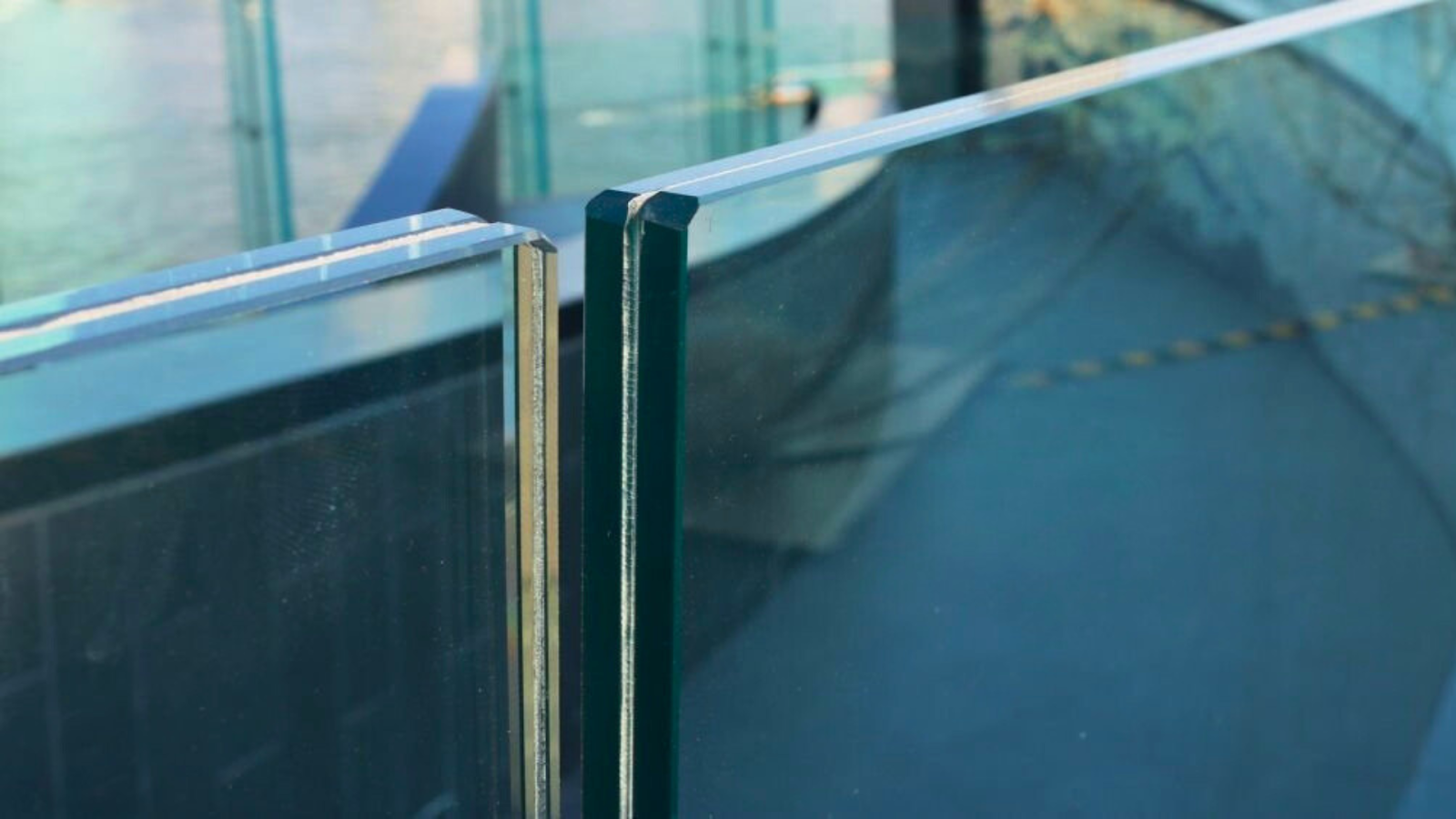 Laminated safety glass pool window for durability and safety