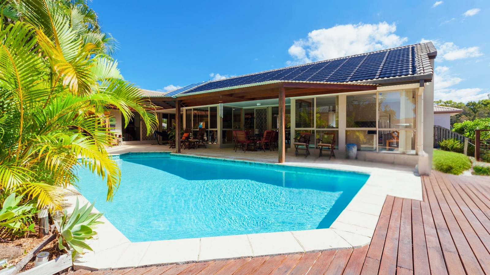 Eco-friendly swimming pool with solar heating and rainwater harvesting system