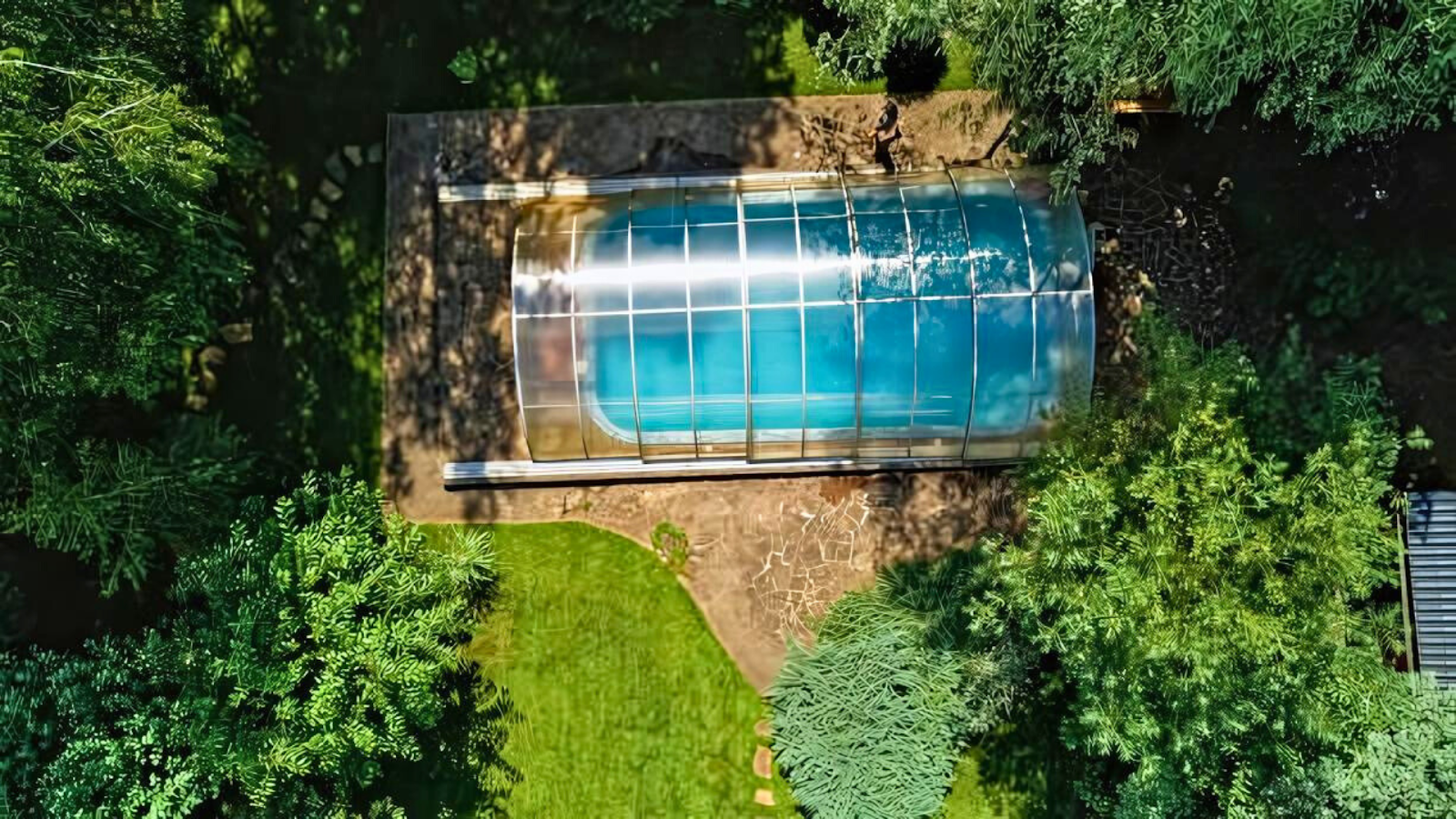 Climate-adaptive pool with retractable cover and elevated design