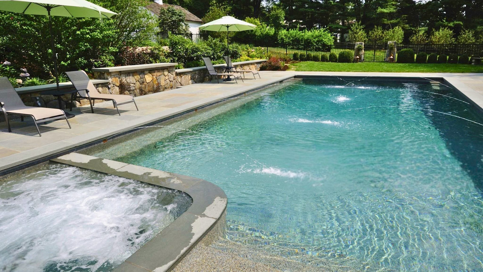 Wellness pool with hydrotherapy jets and zero-entry access