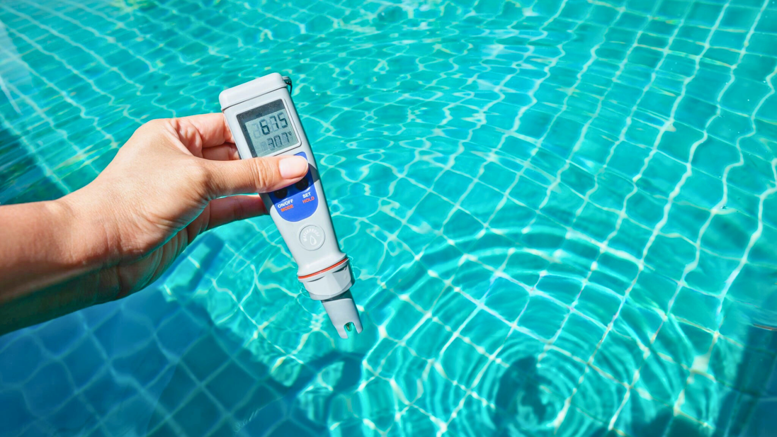 Digital device testing swimming pool pH balance