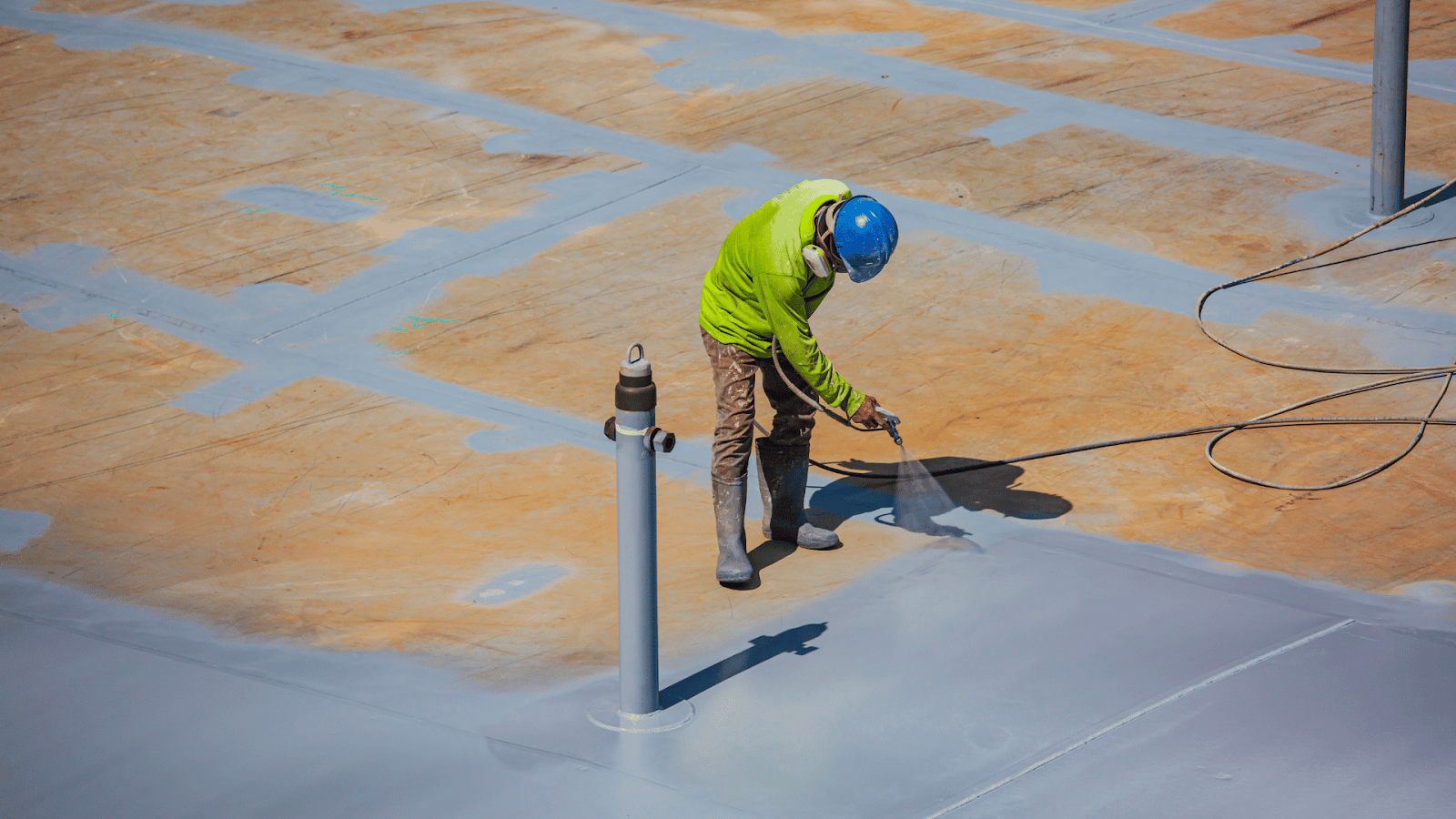 High-performance polymer coating applied to swimming pool surface for durability.