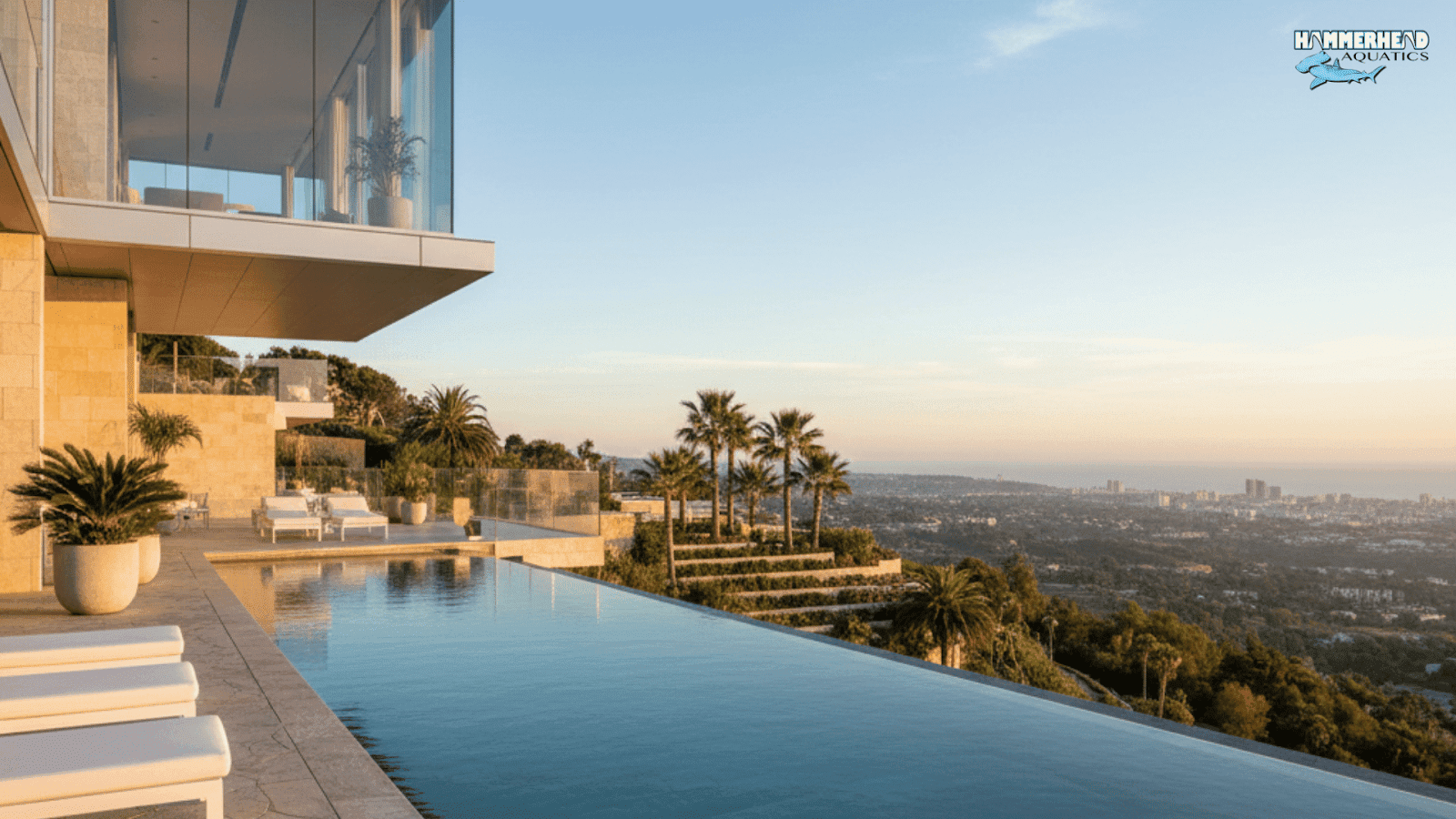 Modern luxury swimming pool with infinity edge and underwater window
