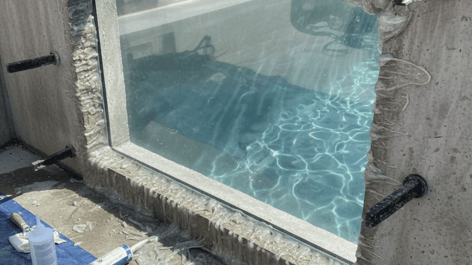 Acrylic swimming pool window installation with waterproof sealing