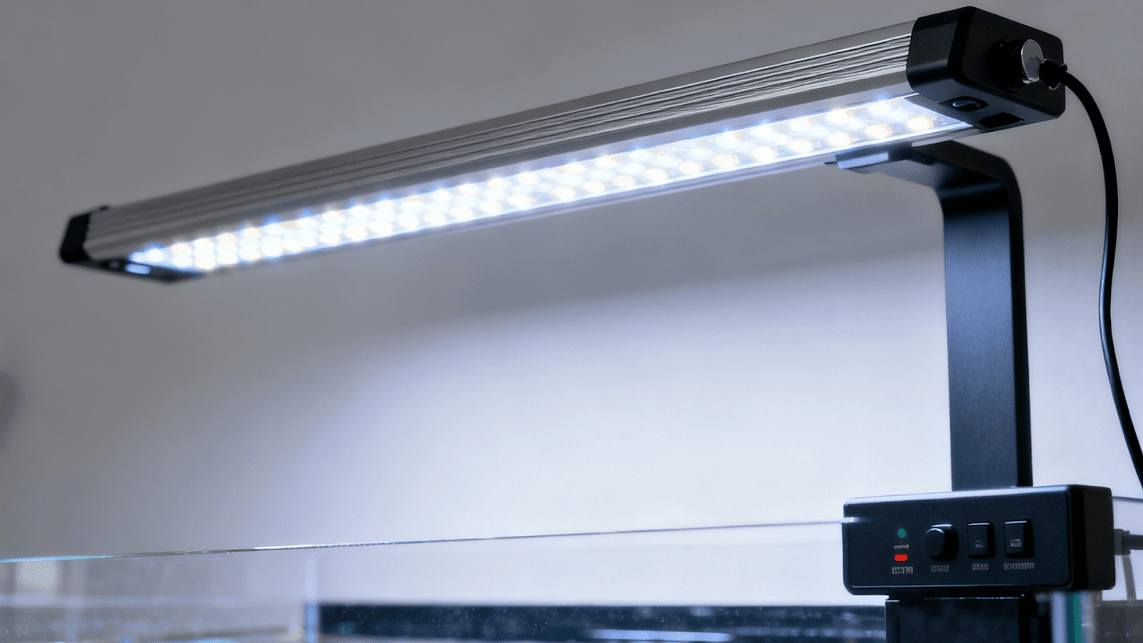 Controlling aquarium lighting with dimmable LED system to prevent algae growth