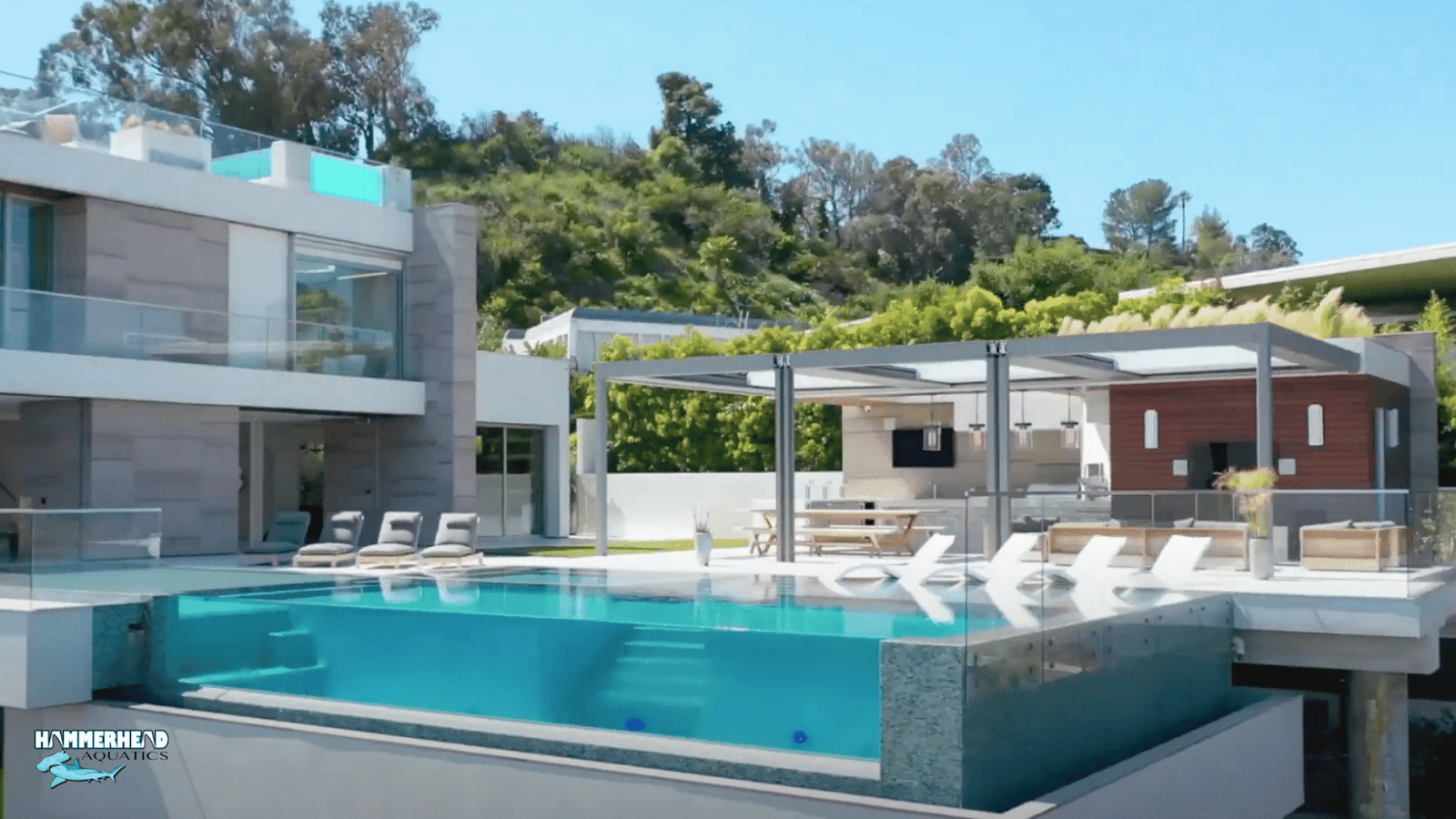 Luxury tiled swimming pool with a professionally installed underwater window