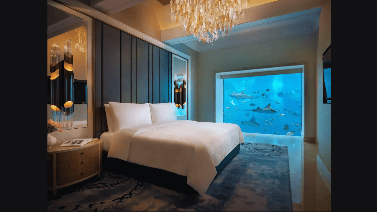 Atlantis The Palm underwater suite with floor-to-ceiling aquarium view of the Ambassador Lagoon.