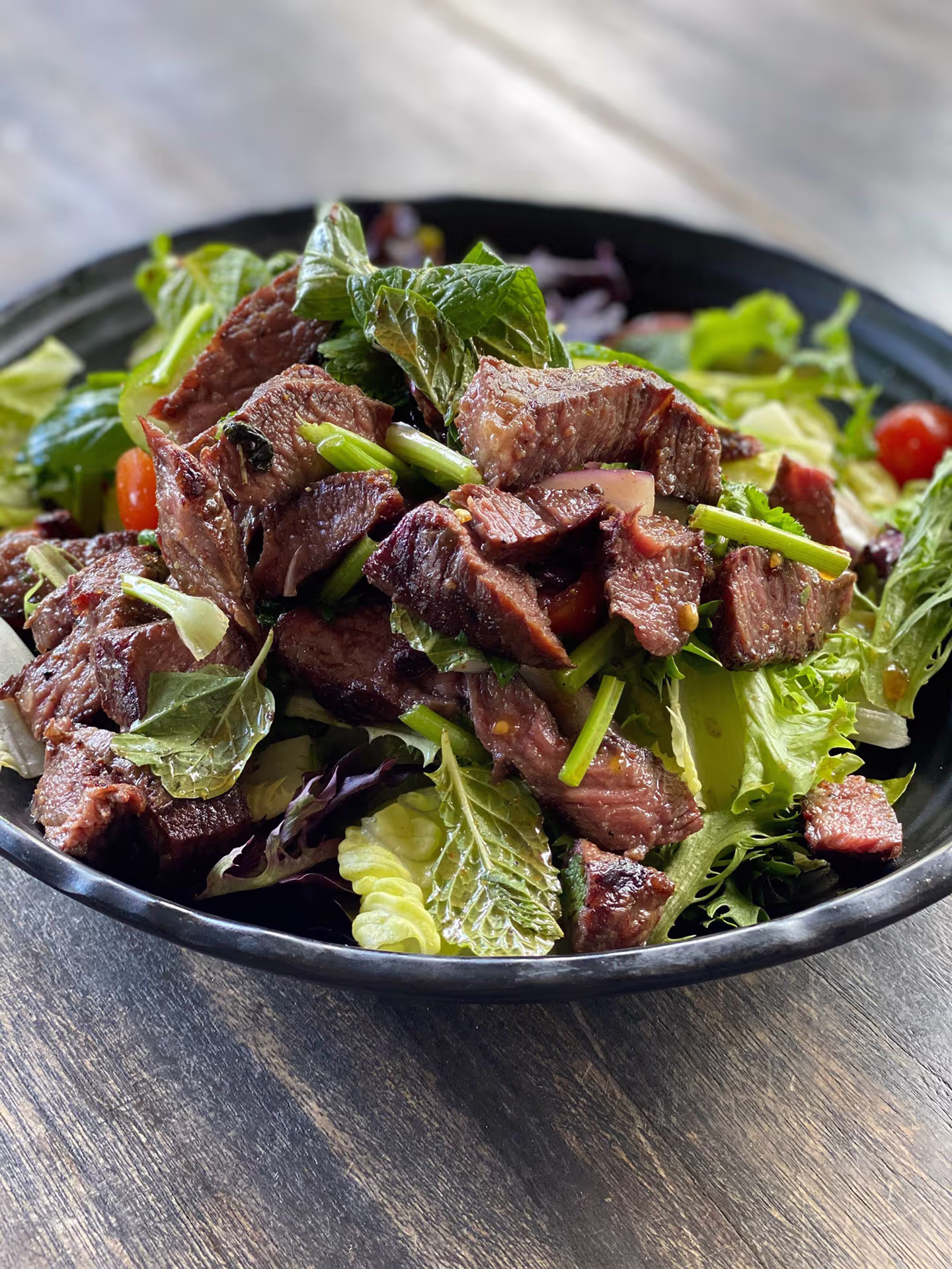 Thai-style steak salad with grilled steak slices.