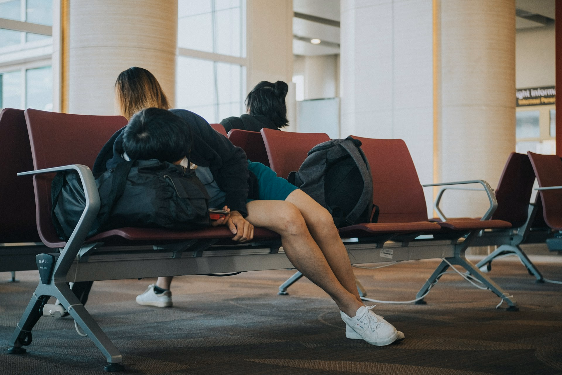 Traveler Sleeping At Airport