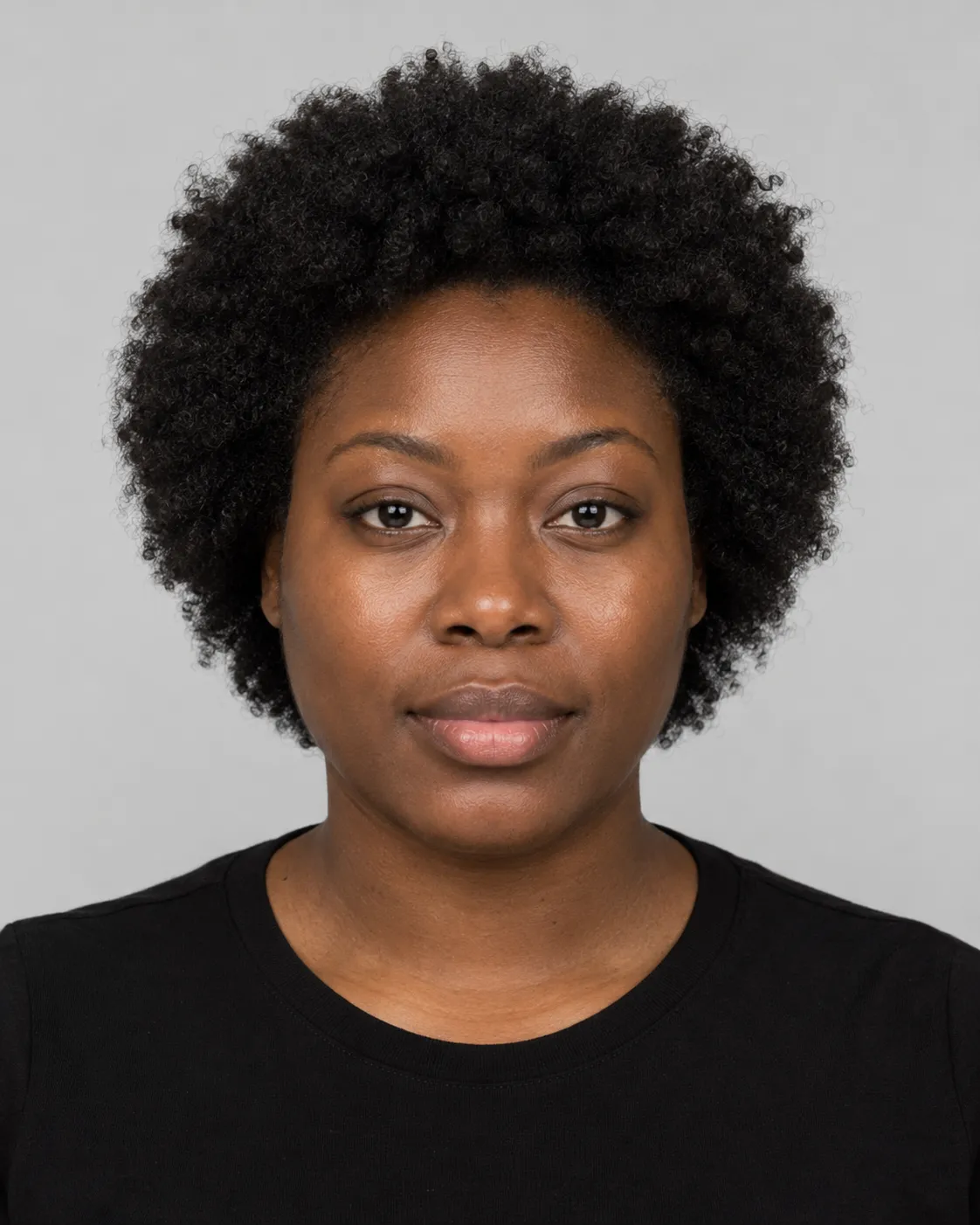 Woman with a dense, tightly coiled type 4c afro, an example of hair suited to the Crown Ritual Head Spa