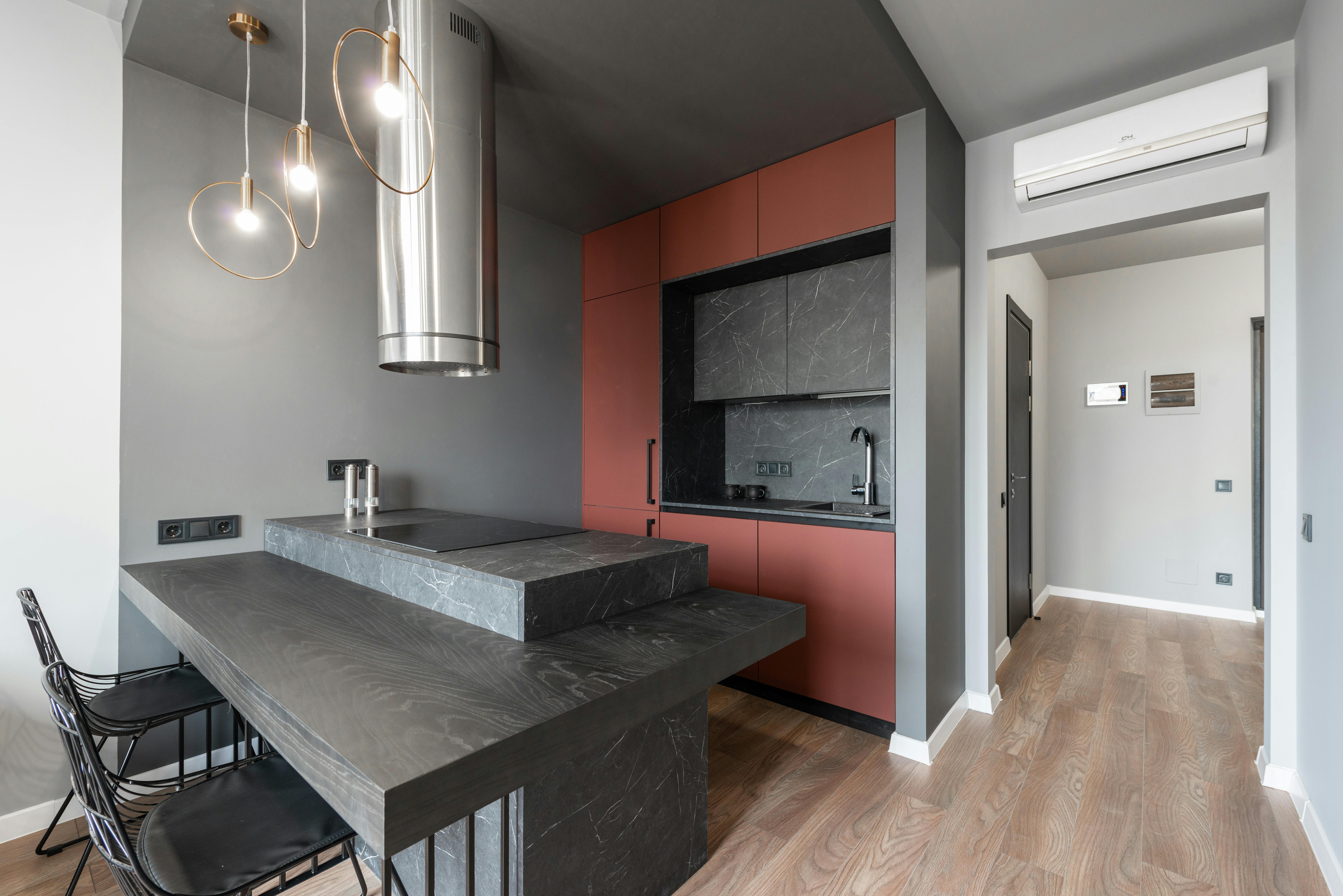  kitchen trends feature bold colors, statement lighting, sustainable materials, and seamlessly integrated smart technology for modern living.