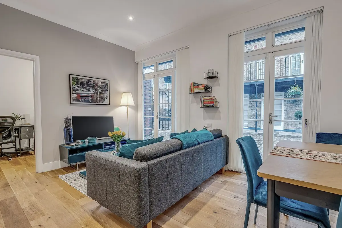 Living room featuring large windows and a cozy modern layout
