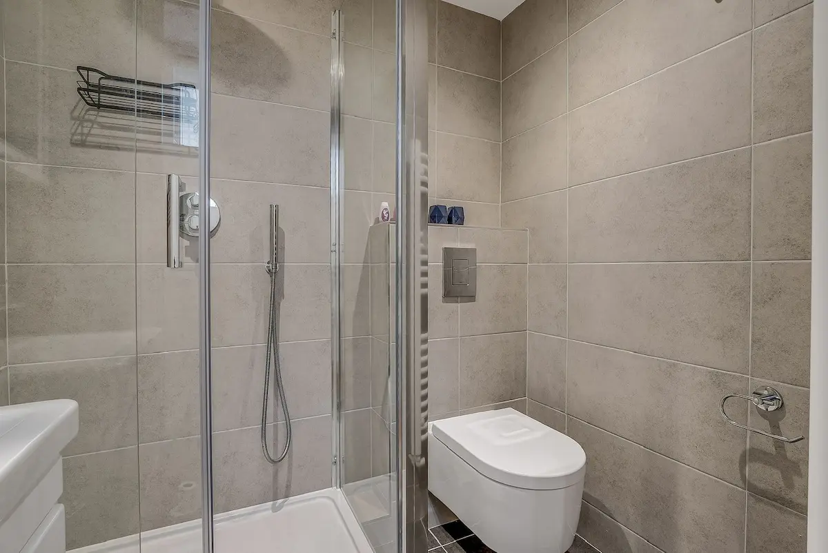 Modern en-suite bathroom with sleek finishes and a walk-in shower