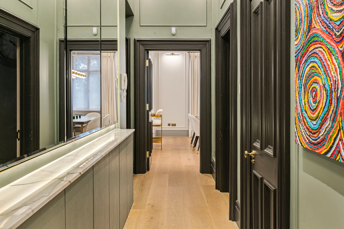 Welcoming entrance hall with elegant flooring and ambient lighting