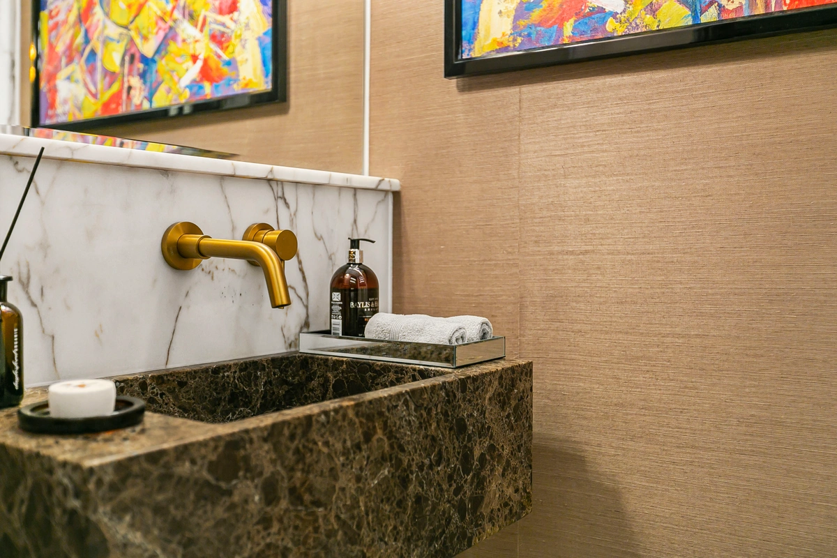 Fully marble bathroom with a walk-in shower and modern fixtures