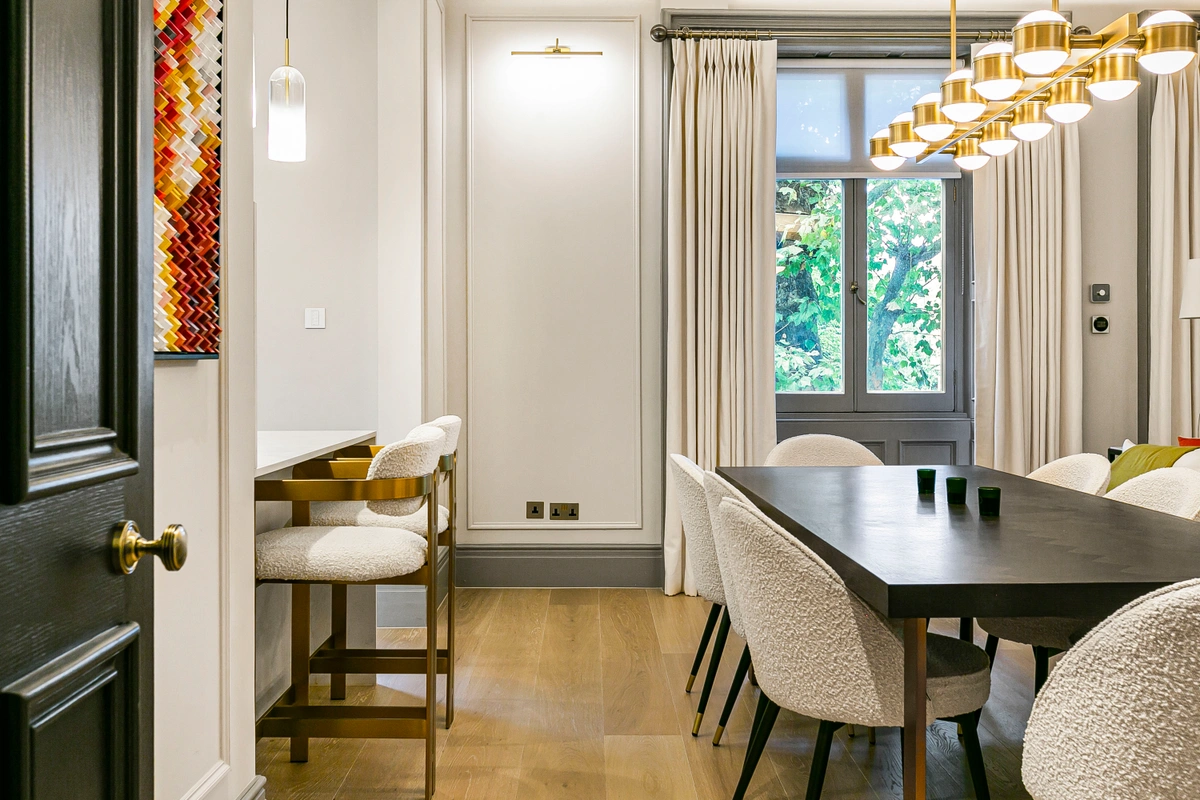 Dining area with a stylish round table and contemporary chairs