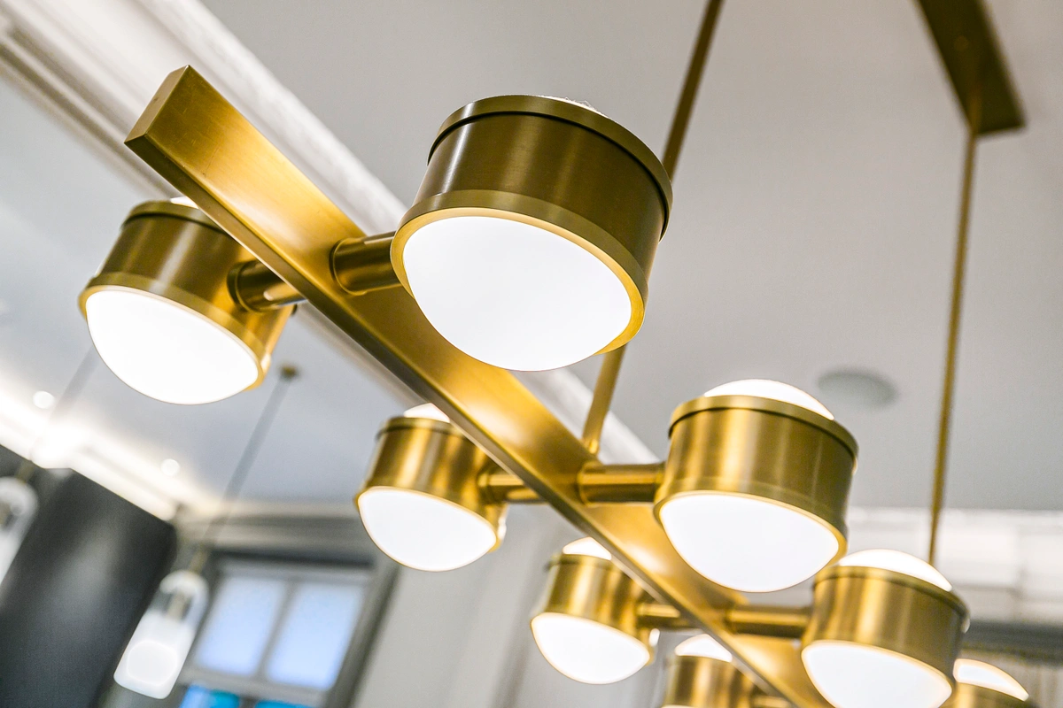 Close-up of a designer pendant light illuminating the dining area