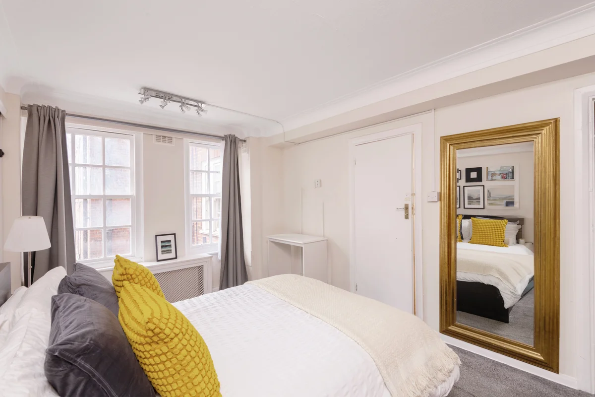 Comfortable bedroom with en-suite and calming color palette