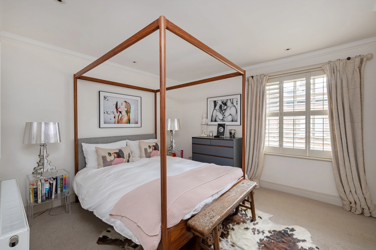 Serene bedroom with plush bedding and soft lighting