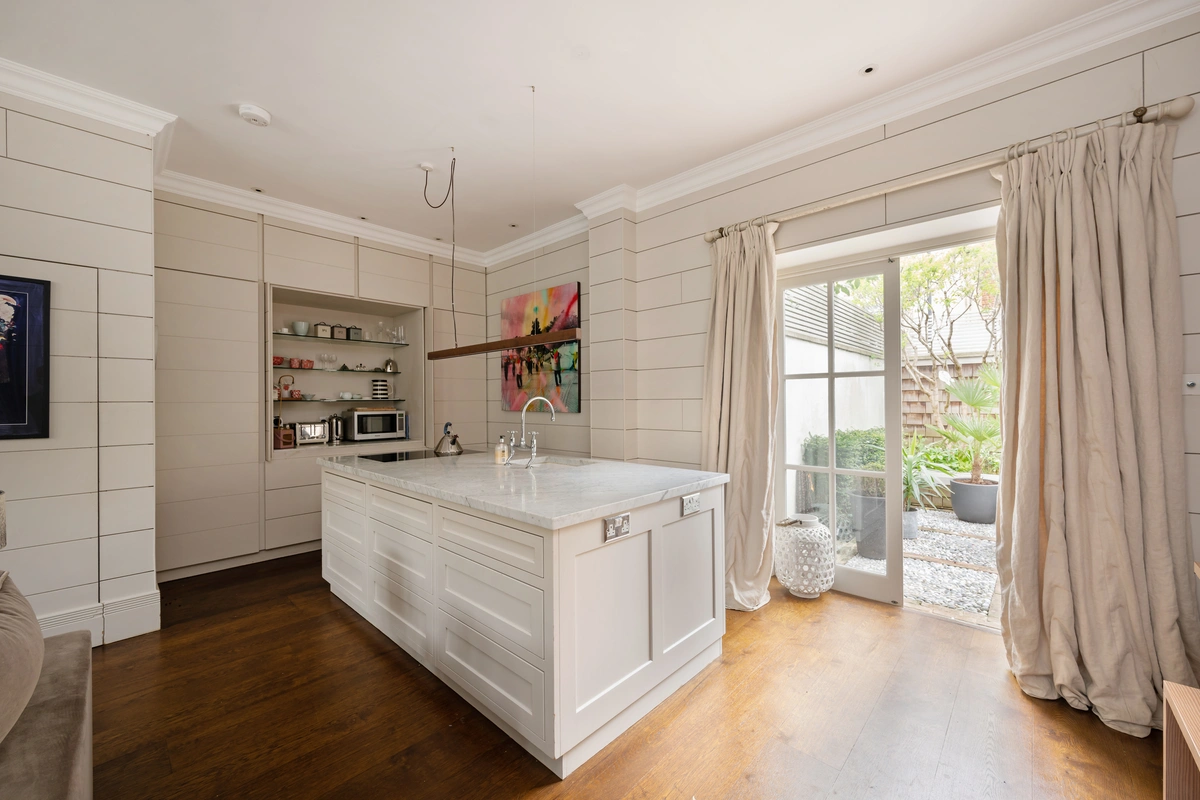 Well-equipped kitchen with sleek countertops and premium appliances