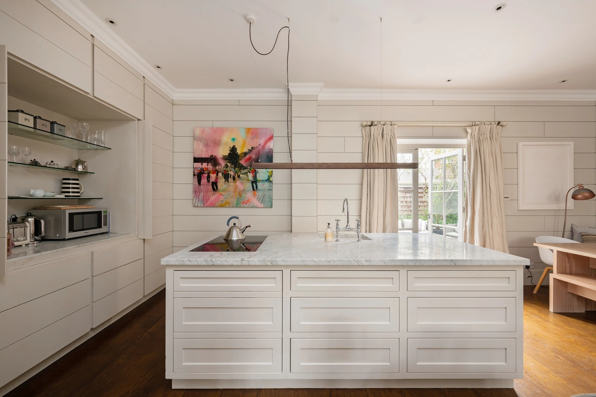 Bright kitchen area with modern fittings and breakfast bar