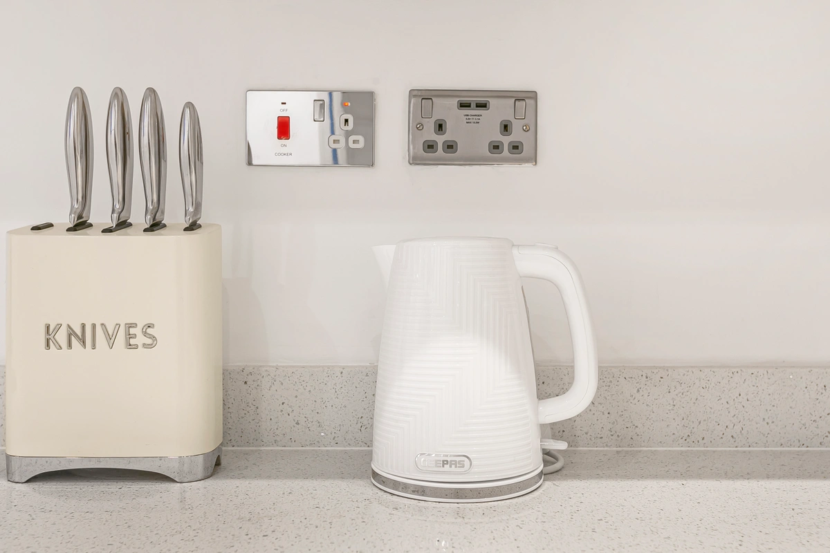 Close-up of premium kitchen appliances including a high-end oven and stovetop