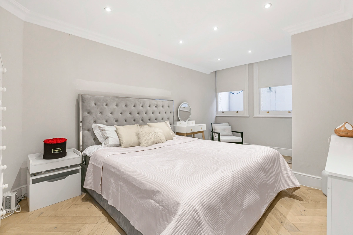 Master bedroom with king-size bed and sophisticated decor