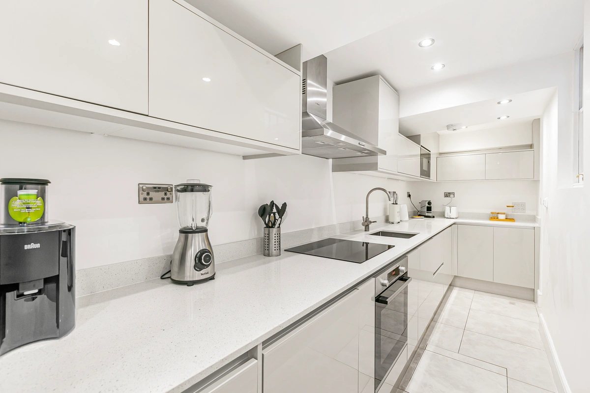Modern kitchen with sleek countertops, high-end appliances, and ample storage space