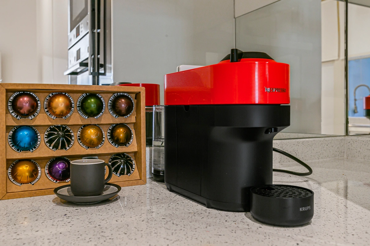 Coffee machine on a sleek countertop with accessories