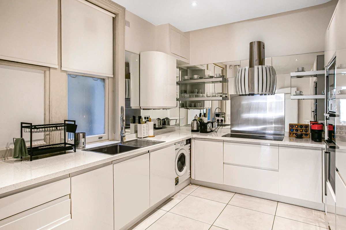 Modern kitchen with high-end appliances and marble finishes