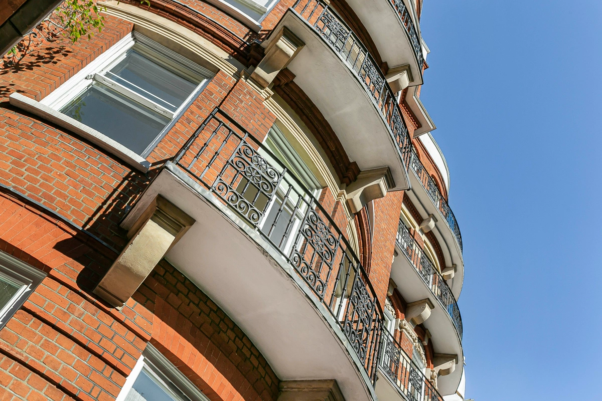 Building façade with classic architecture and private entrance