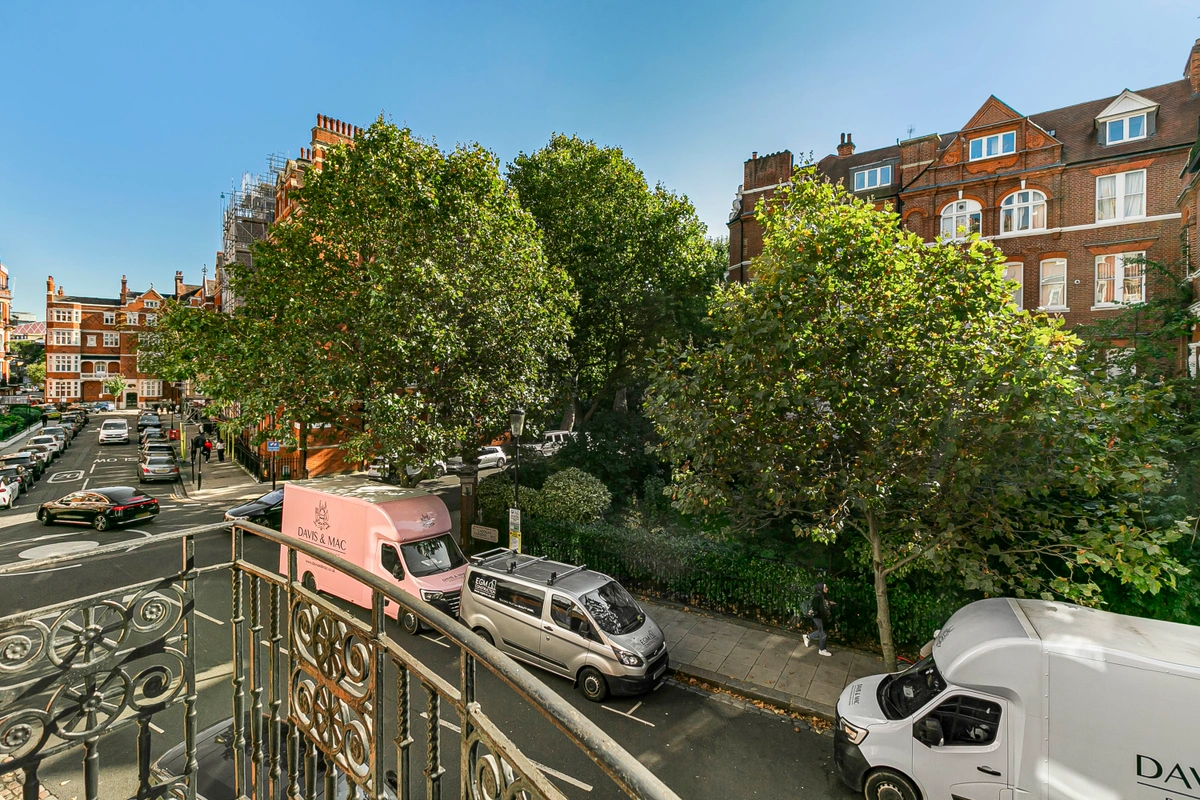 Second balcony offering city views and stylish outdoor furniture