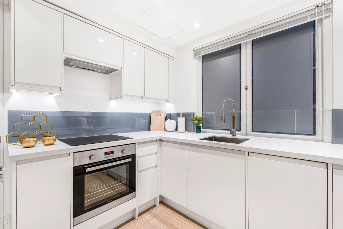 Second kitchen angle showcasing island and high-end finishes