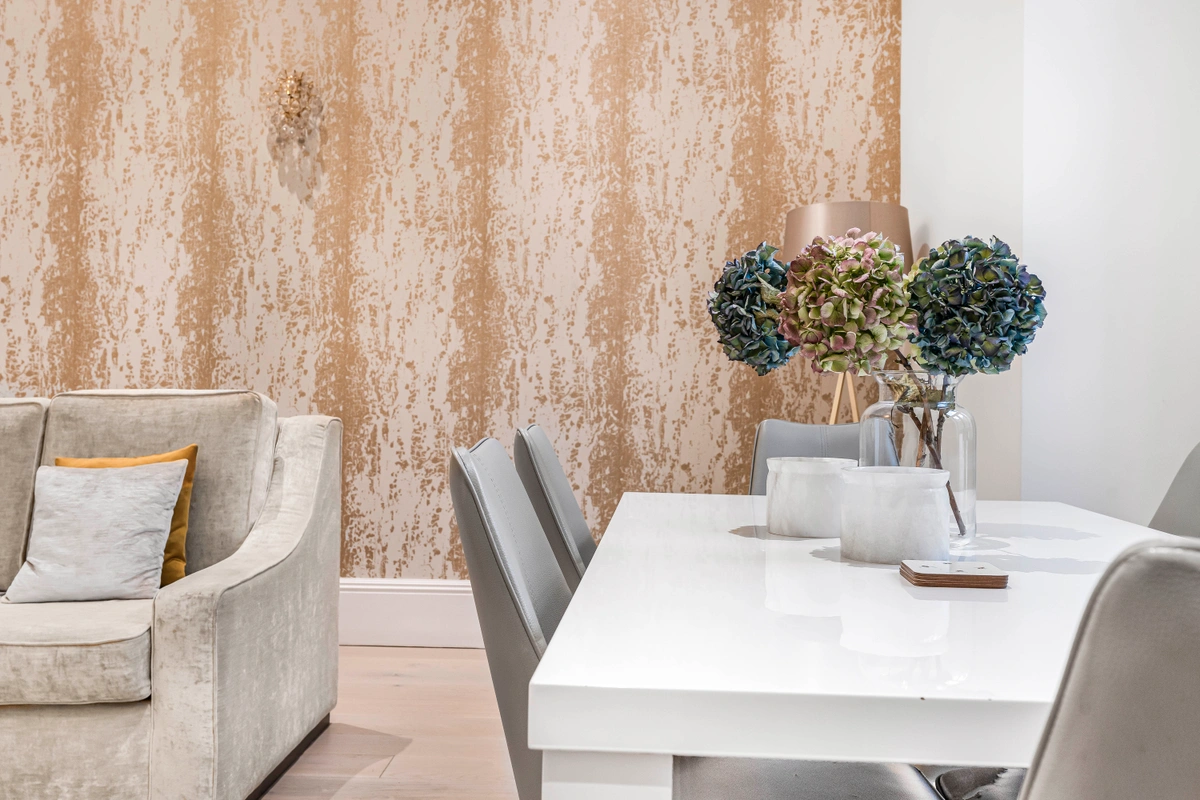 Dining table set for a meal with refined tableware and centerpiece