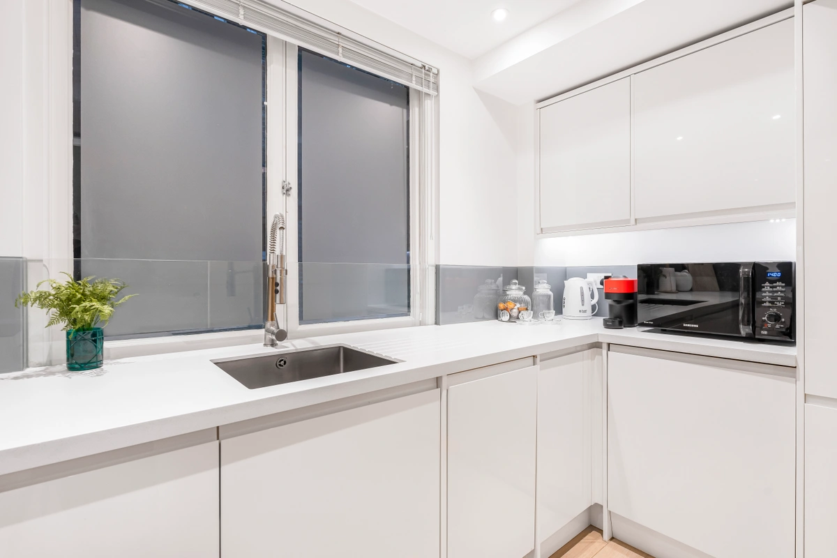 Contemporary kitchen with integrated appliances and sleek finishes