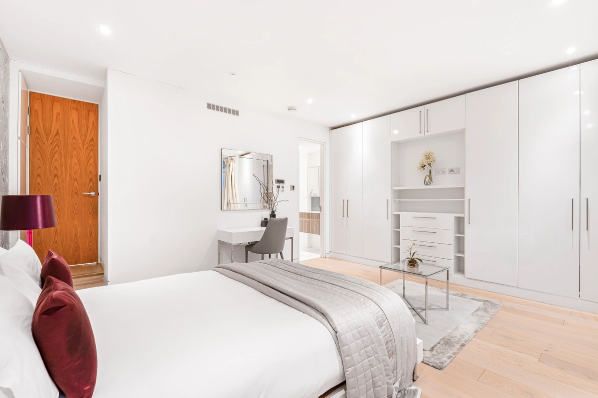 Sophisticated bedroom with plush bedding and classic London style