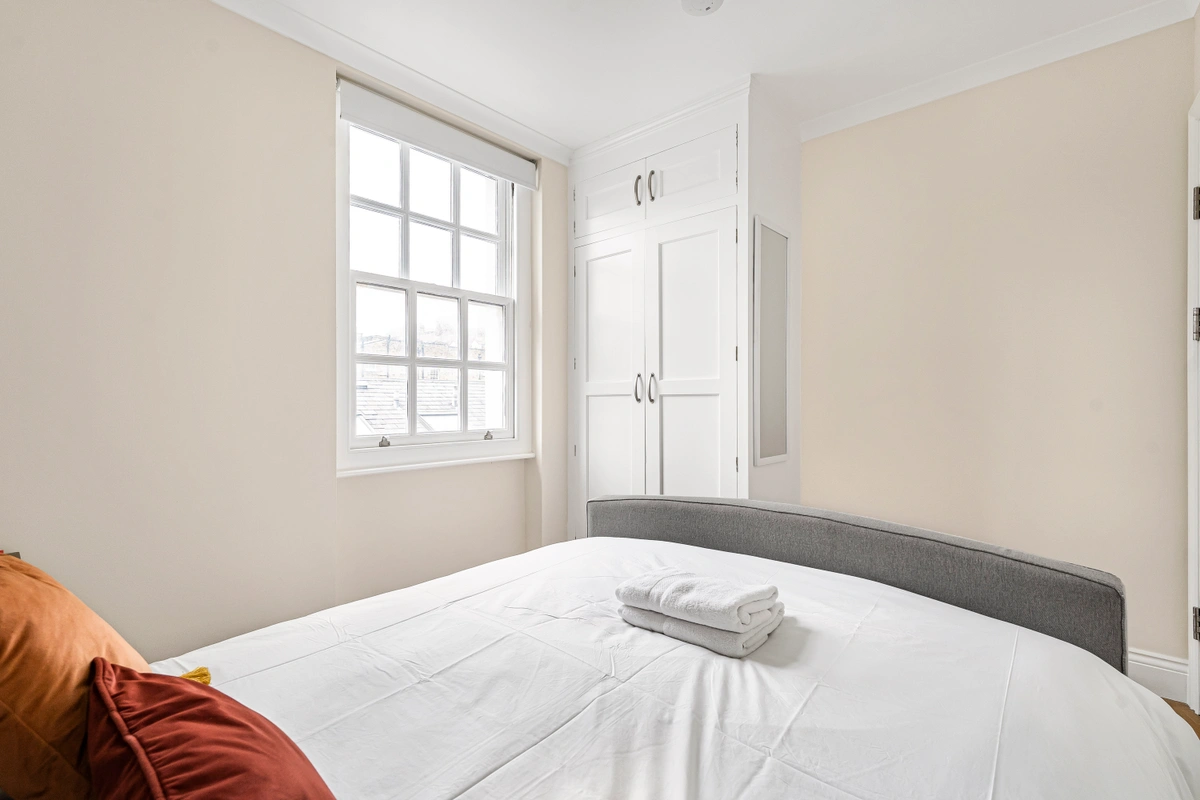 Bright and airy bedroom with a comfortable bed and calming decor