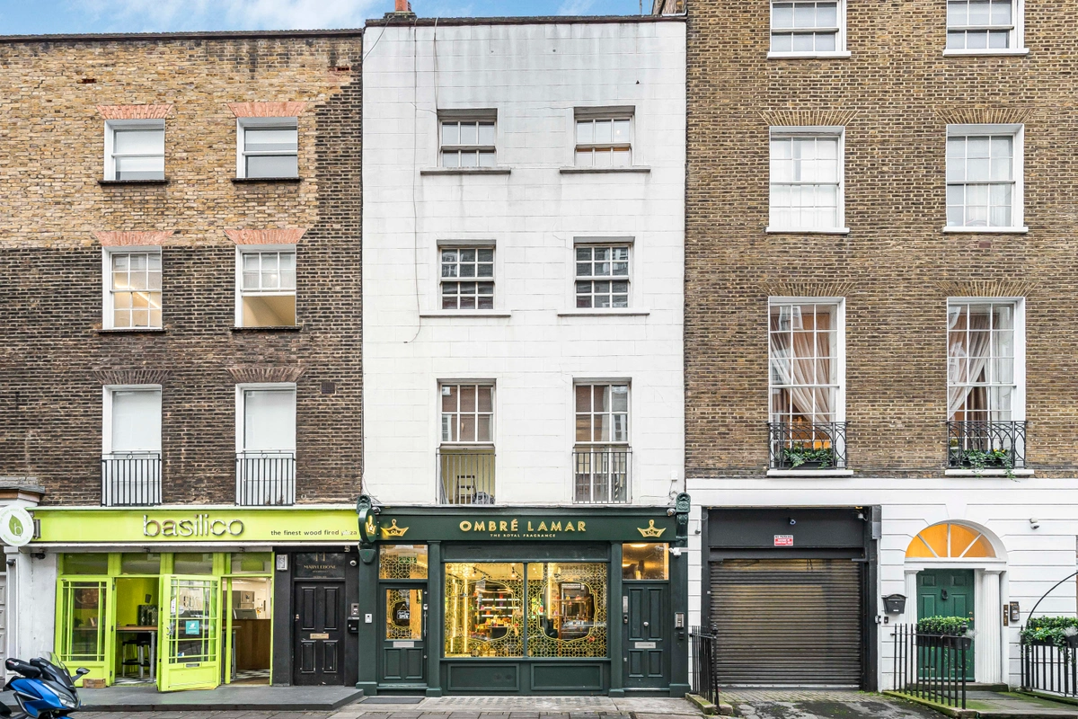 Charming building facade with a welcoming entrance and classic design