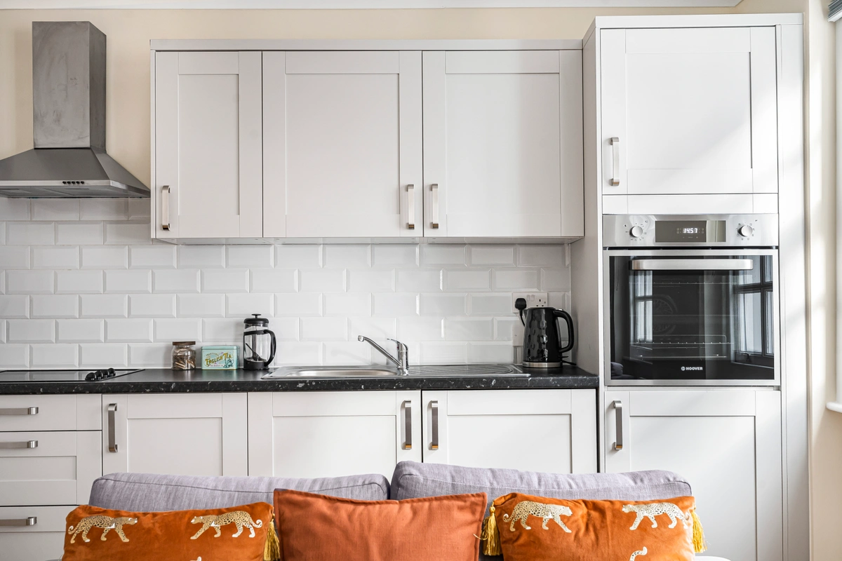 Sleek kitchen with stainless steel appliances and contemporary design
