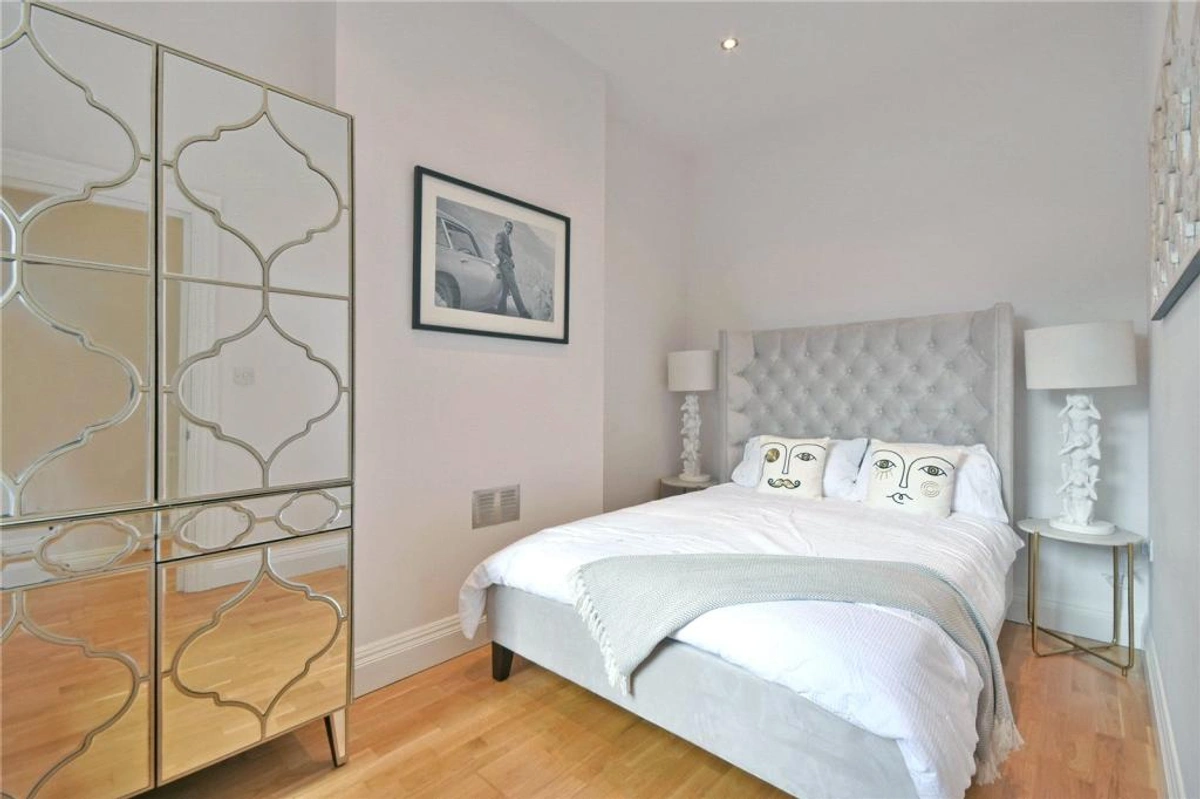 Bright bedroom with comfortable bed and minimalist design
