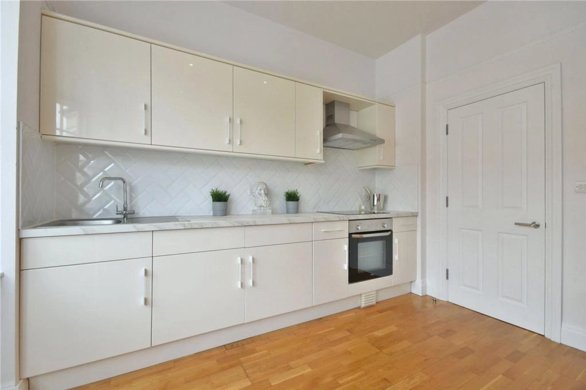 Fully equipped kitchen with new appliances and sleek countertops