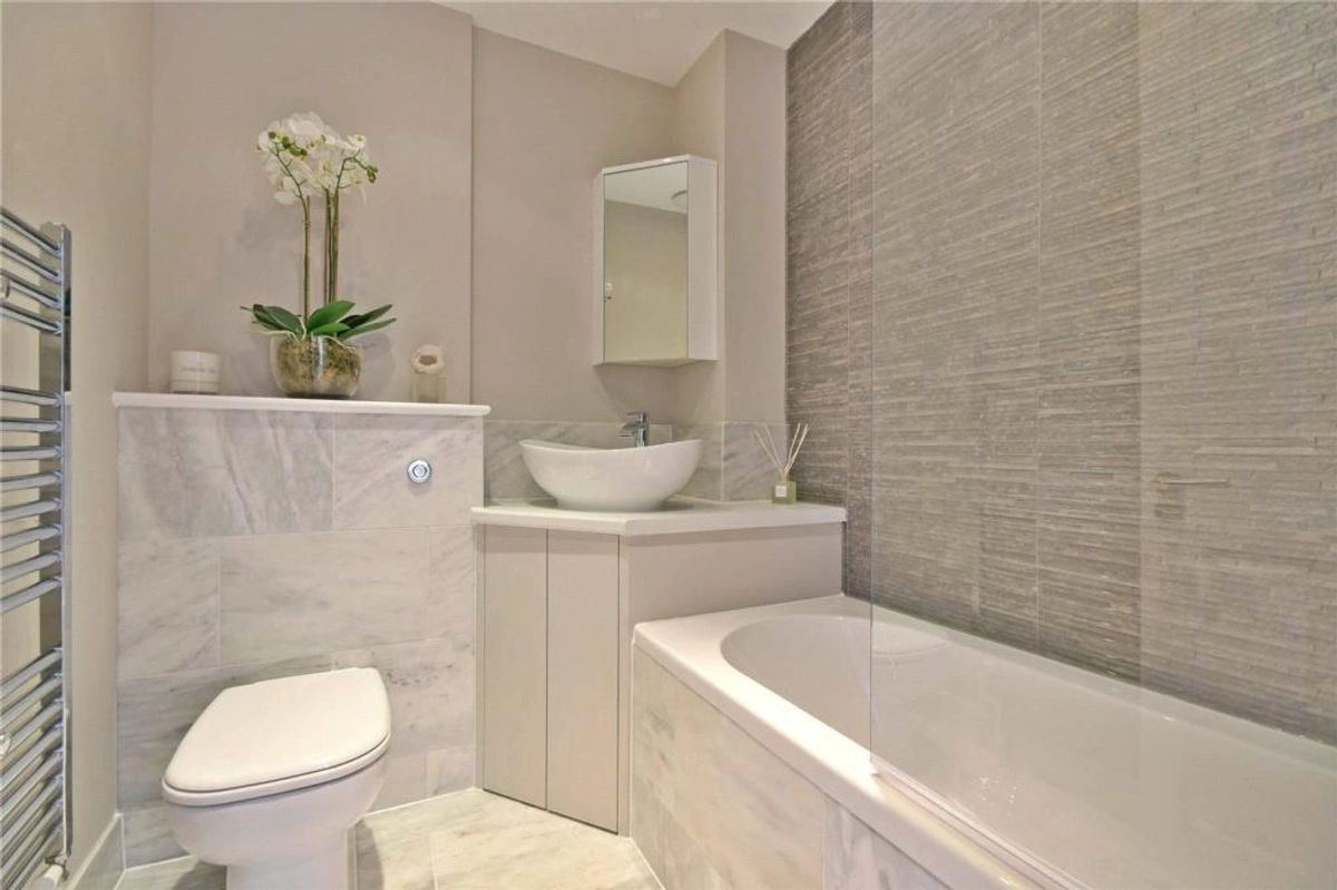 Modern bathroom with clean lines, walk-in shower, and contemporary fixtures