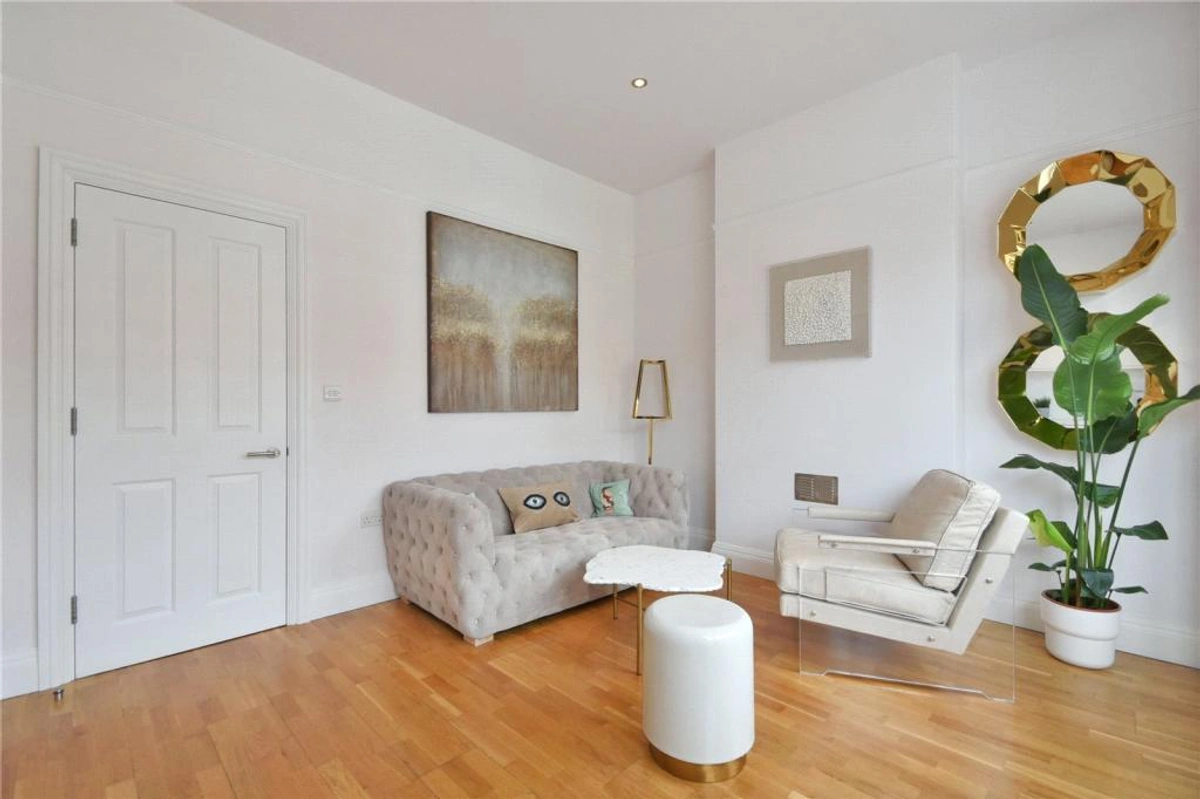 Spacious living room with modern decor and plenty of natural light